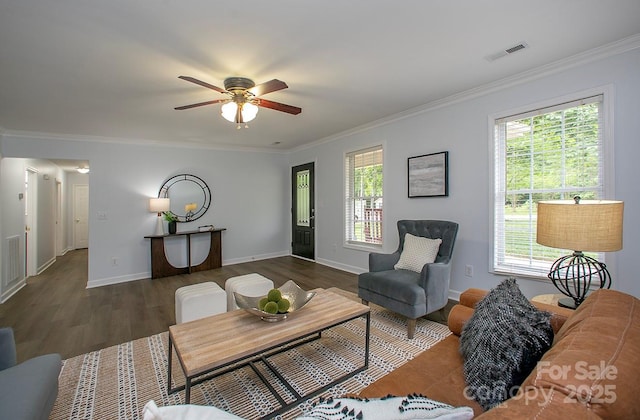 1610 Ford St, Charlotte, NC 28216 - living area with ceiling fan, ornamental molding, plenty of natural light, wood finished floors, and baseboards