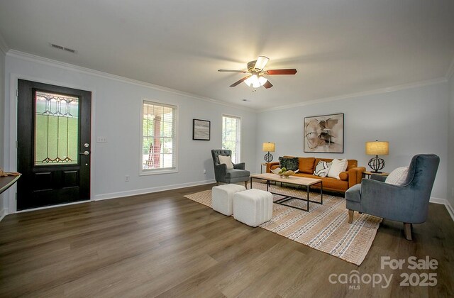 1610 Ford St, Charlotte, NC 28216 - living room featuring wood finished floors, ornamental molding, ceiling fan, and baseboards