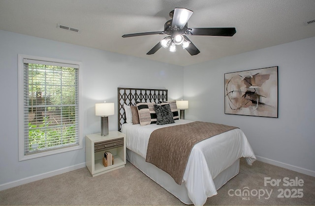 1610 Ford St, Charlotte, NC 28216 - carpeted bedroom with baseboards and a ceiling fan