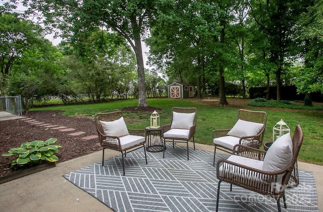 1610 Ford St, Charlotte, NC 28216 - view of patio / terrace with a storage unit, an outbuilding, and view of scattered trees