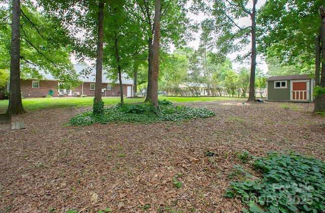 1610 Ford St, Charlotte, NC 28216 - view of yard featuring a shed and an outbuilding