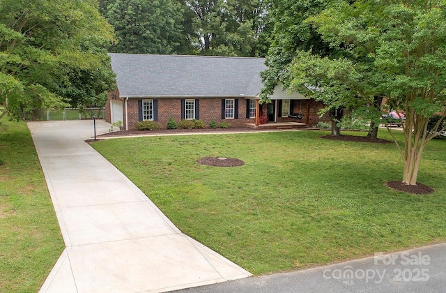 1610 Ford St, Charlotte, NC 28216 - view of front of home featuring a front yard, concrete driveway, an attached garage, and roof with shingles