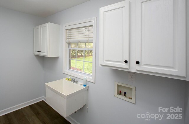 1610 Ford St, Charlotte, NC 28216 - laundry area with washer hookup, dark wood finished floors, cabinet space, and baseboards