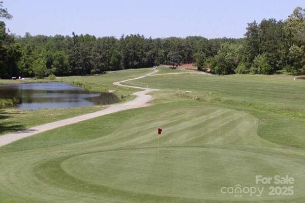 1610 Ford St, Charlotte, NC 28216 - view of property's community featuring a water view, view of golf course, and a wooded view