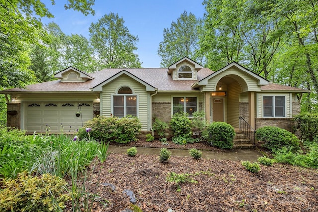 5 Governors Dr, Hendersonville, NC 28791 - view of front of home with brick siding, a shingled roof, and an attached garage