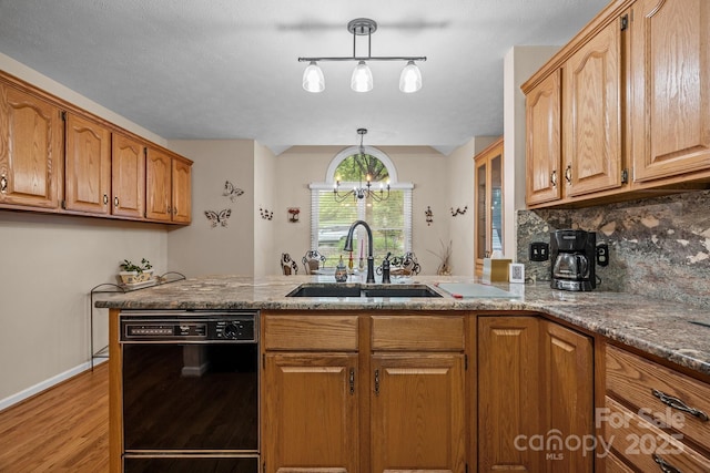 5 Governors Dr, Hendersonville, NC 28791 - kitchen featuring dishwasher, a sink, light wood-style flooring, and stone countertops