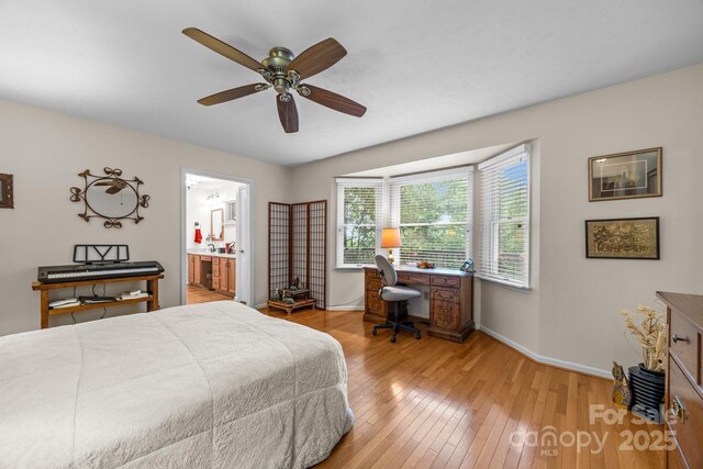 5 Governors Dr, Hendersonville, NC 28791 - bedroom featuring an office area, wood-type flooring, baseboards, ensuite bathroom, and ceiling fan