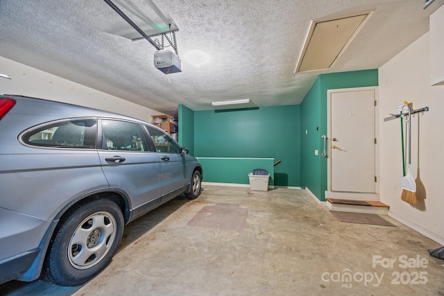 5 Governors Dr, Hendersonville, NC 28791 - garage featuring a garage door opener and baseboards