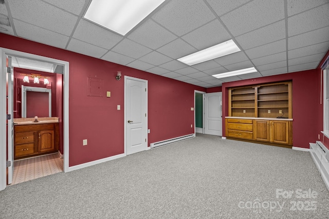 5 Governors Dr, Hendersonville, NC 28791 - below grade area featuring carpet, built in features, a paneled ceiling, a baseboard heating unit, and baseboards