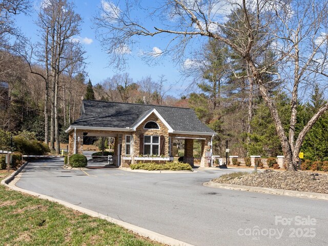5 Governors Dr, Hendersonville, NC 28791 - view of front of property featuring stone siding and a shingled roof
