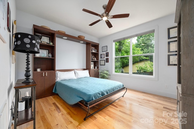 77 5th Ave, Asheville, NC 28806 - bedroom featuring light wood-type flooring and ceiling fan
