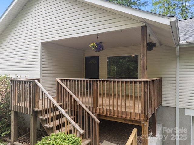 16 Lake Forest Ln, Hendersonville, NC 28739 - entrance to property with a wooden deck and roof with shingles
