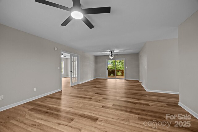 16 Lake Forest Ln, Hendersonville, NC 28739 - unfurnished room with ceiling fan, light wood-style floors, and baseboards