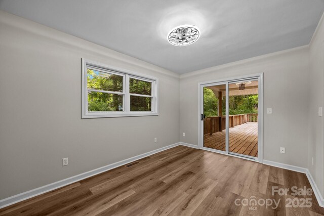 16 Lake Forest Ln, Hendersonville, NC 28739 - empty room featuring wood finished floors and baseboards