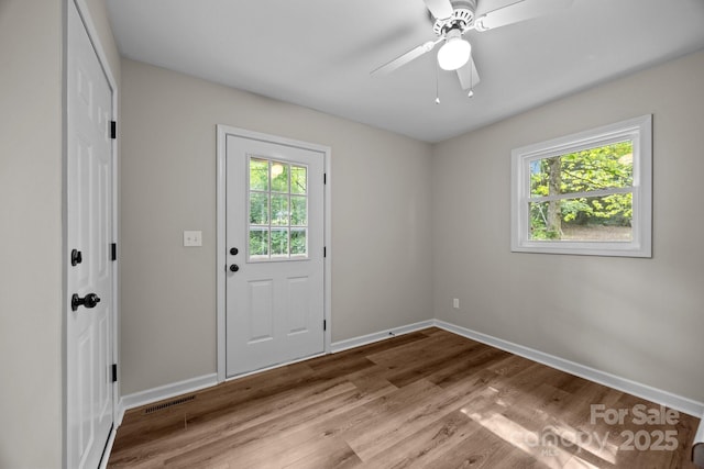 16 Lake Forest Ln, Hendersonville, NC 28739 - doorway featuring healthy amount of natural light, baseboards, and wood finished floors