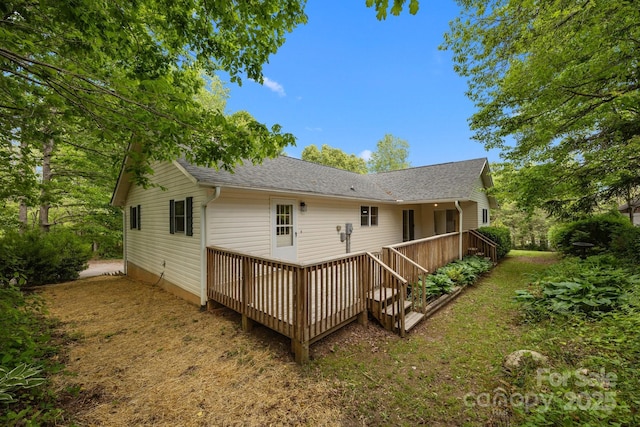 16 Lake Forest Ln, Hendersonville, NC 28739 - rear view of house with a shingled roof and a wooden deck