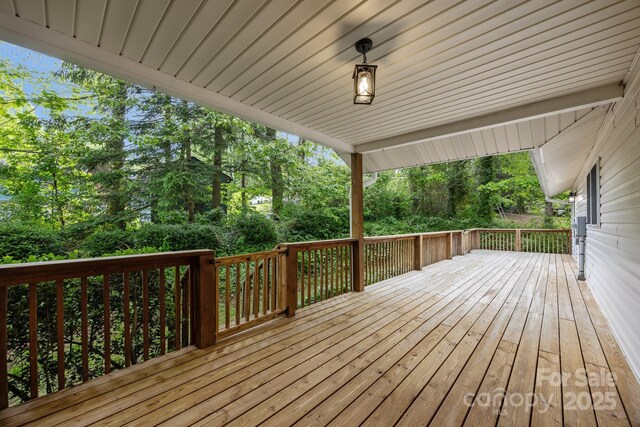 16 Lake Forest Ln, Hendersonville, NC 28739 - wooden deck with view of scattered trees