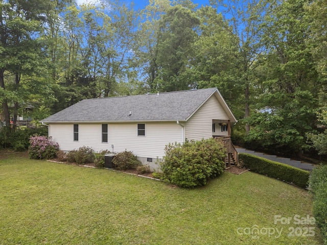 16 Lake Forest Ln, Hendersonville, NC 28739 - view of side of property featuring a lawn, crawl space, roof with shingles, and central AC