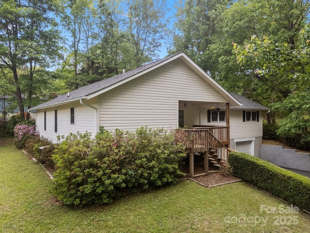 16 Lake Forest Ln, Hendersonville, NC 28739 - back of property with stairs, a yard, a garage, a shingled roof, and covered porch