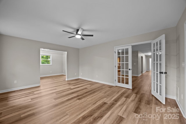16 Lake Forest Ln, Hendersonville, NC 28739 - spare room with french doors, a ceiling fan, light wood finished floors, and baseboards