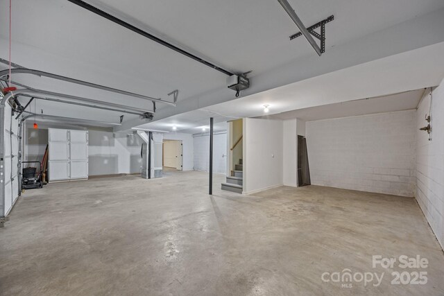 16 Lake Forest Ln, Hendersonville, NC 28739 - garage with a garage door opener and concrete block wall