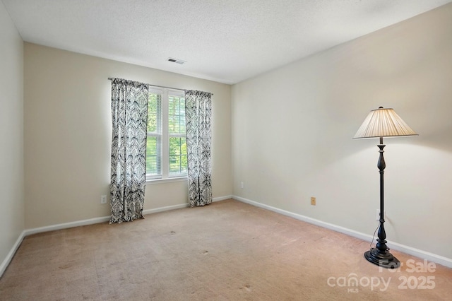8744 Barrister Way, Charlotte, NC 28216 - empty room with carpet floors, baseboards, and a textured ceiling