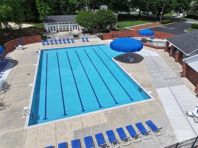 8744 Barrister Way, Charlotte, NC 28216 - community pool with a patio, an outbuilding, and fence