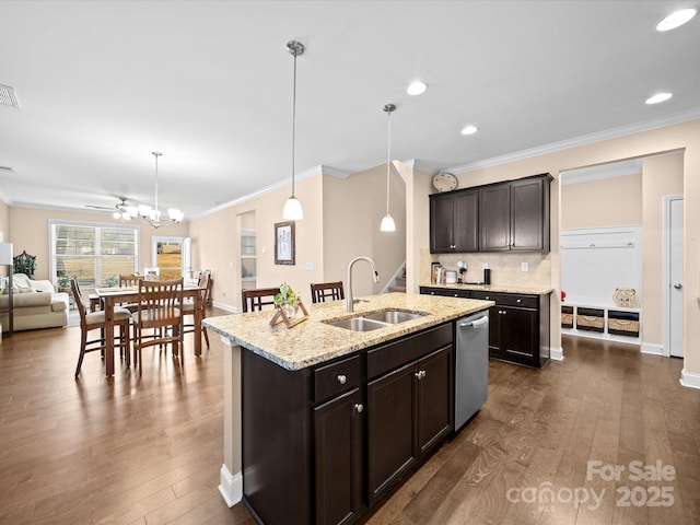 kitchen with a sink, stainless steel dishwasher, crown molding, dark brown cabinets, and dark wood-style flooring
