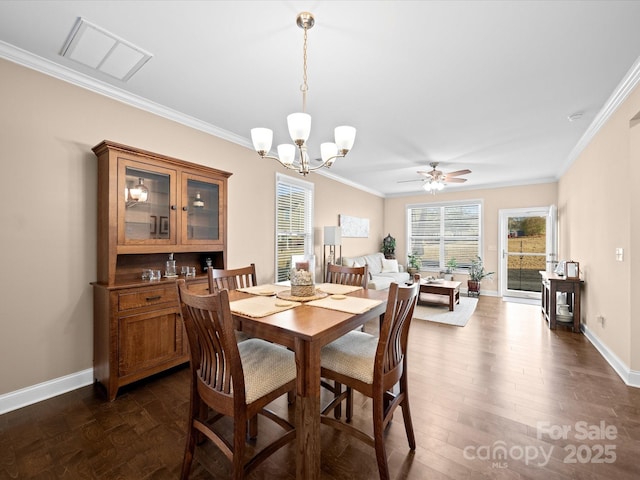 dining space featuring crown molding, healthy amount of natural light, baseboards, a chandelier, and dark wood-style flooring