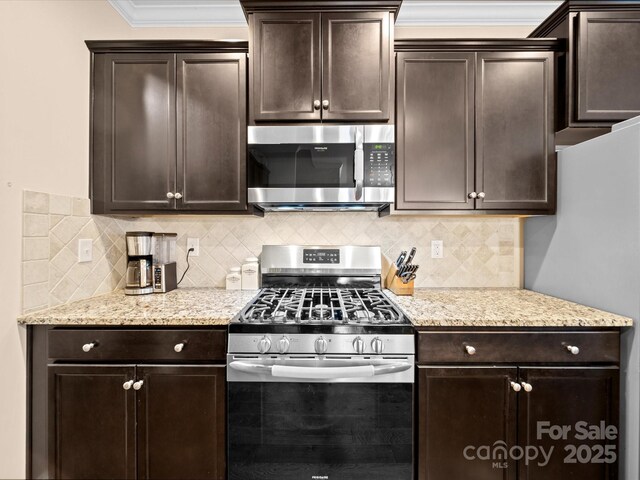 kitchen with stainless steel appliances, dark brown cabinetry, tasteful backsplash, and crown molding