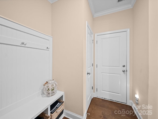 mudroom featuring ornamental molding, dark wood-style flooring, and baseboards