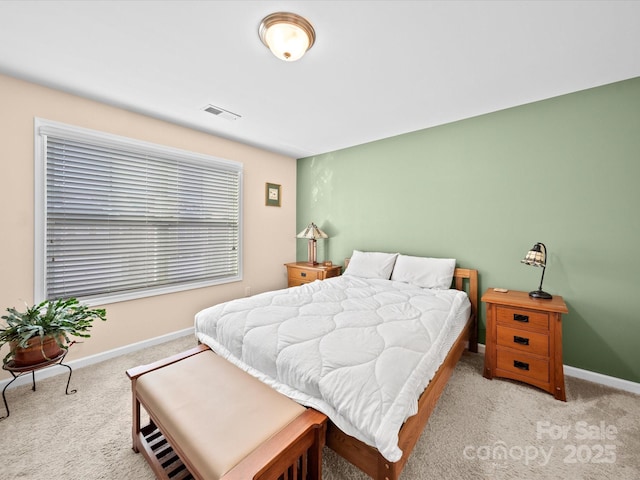 carpeted bedroom featuring baseboards