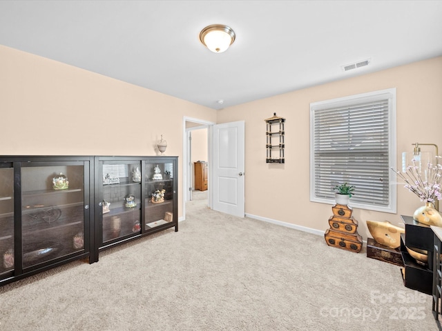 carpeted office space with baseboards
