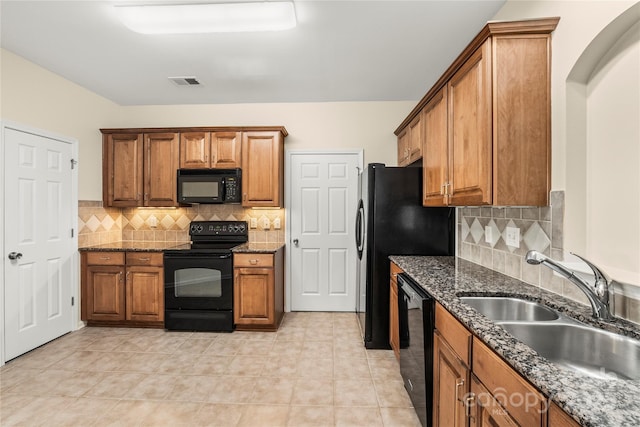 14853 Santa Lucia Dr, Charlotte, NC 28277 - kitchen with black appliances, a sink, brown cabinetry, and backsplash