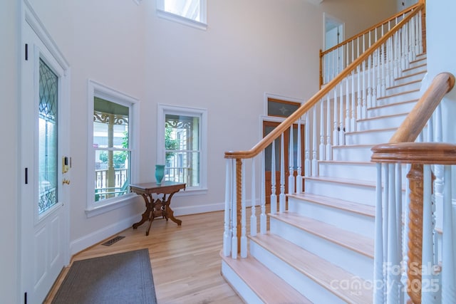 416 E Park Ave, Charlotte, NC 28203 - entryway with wood finished floors, stairs, and a towering ceiling