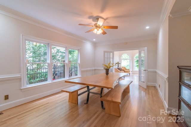 416 E Park Ave, Charlotte, NC 28203 - dining area with light wood finished floors, a ceiling fan, crown molding, recessed lighting, and a wainscoted wall
