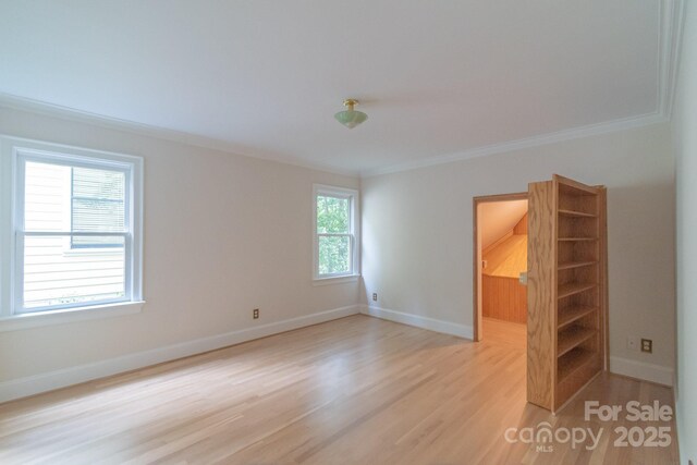 416 E Park Ave, Charlotte, NC 28203 - empty room featuring crown molding and light wood-type flooring