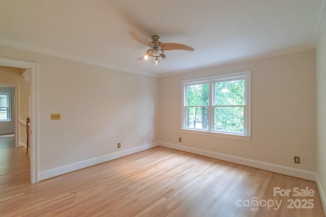 416 E Park Ave, Charlotte, NC 28203 - empty room featuring crown molding, a ceiling fan, and light wood finished floors