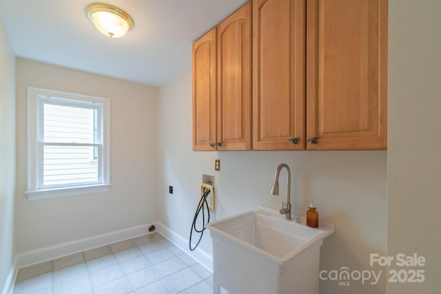 416 E Park Ave, Charlotte, NC 28203 - laundry room featuring washer hookup, cabinet space, and light tile patterned floors
