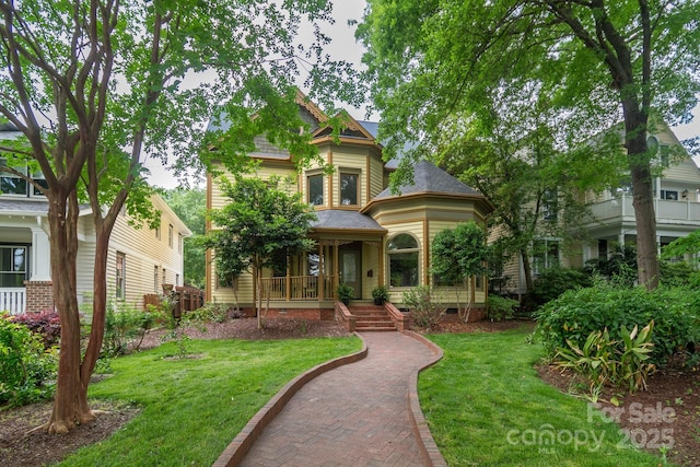 416 E Park Ave, Charlotte, NC 28203 - victorian house with crawl space, a front yard, covered porch, and roof with shingles