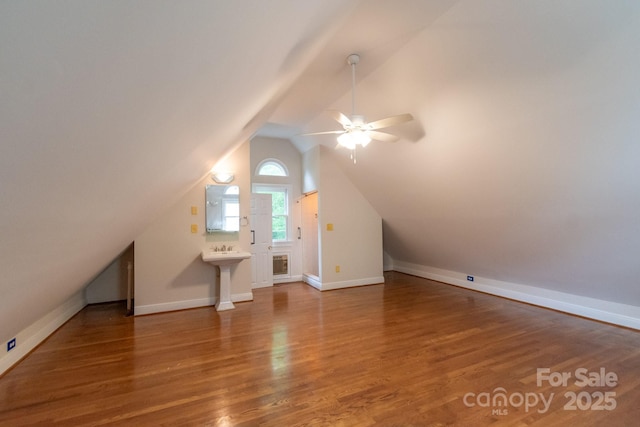 416 E Park Ave, Charlotte, NC 28203 - additional living space featuring a ceiling fan, vaulted ceiling, and wood finished floors
