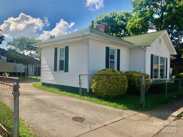 447 17th St, Cramerton, NC 28032 - view of property exterior with fence, a chimney, and driveway