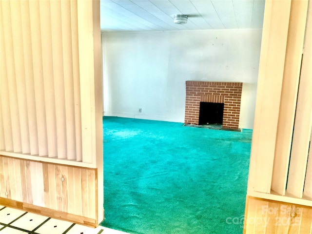 447 17th St, Cramerton, NC 28032 - unfurnished living room featuring a brick fireplace and carpet floors