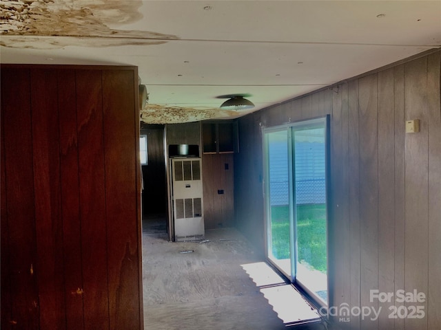 447 17th St, Cramerton, NC 28032 - corridor featuring a heating unit, healthy amount of natural light, and wooden walls