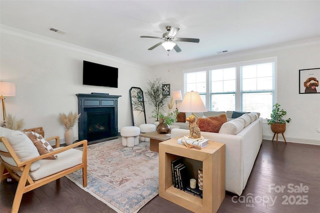 8916 Inverness Bay Rd, Charlotte, NC 28278 - living area featuring ornamental molding, a fireplace, a ceiling fan, baseboards, and wood finished floors