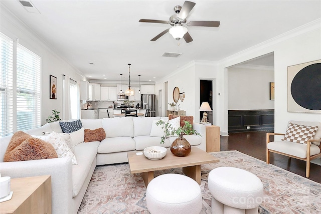 8916 Inverness Bay Rd, Charlotte, NC 28278 - living room with wood finished floors, crown molding, and ceiling fan