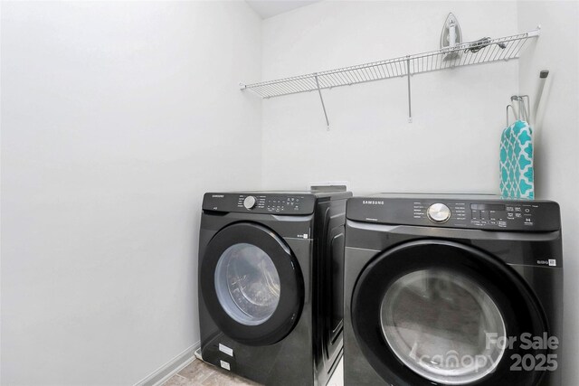 8916 Inverness Bay Rd, Charlotte, NC 28278 - laundry room with washing machine and dryer and baseboards