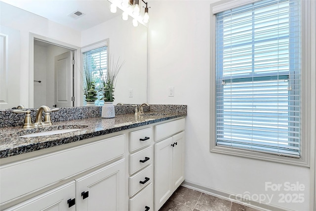 8916 Inverness Bay Rd, Charlotte, NC 28278 - bathroom with baseboards, double vanity, and tile patterned flooring