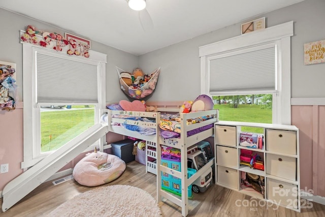 bedroom with wood finished floors and ceiling fan