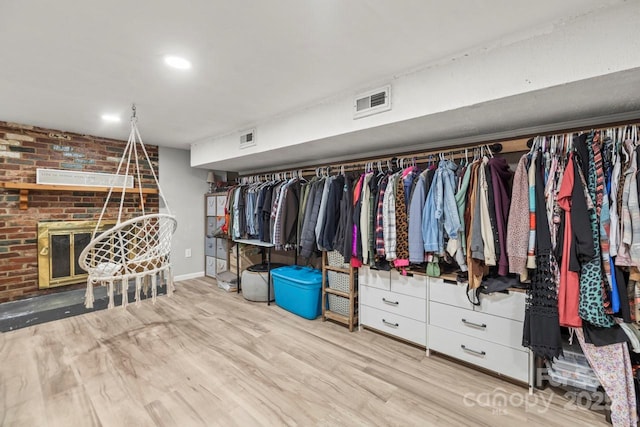 spacious closet featuring wood finished floors